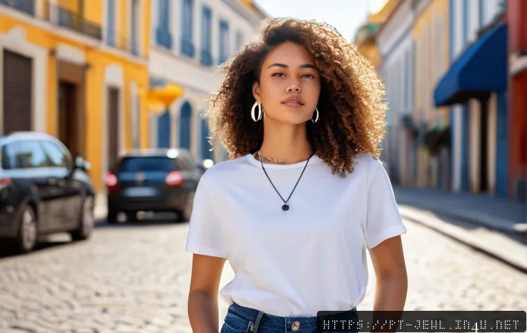 블랙 쥬얼리 스타일링 아이디어 - A stylish young woman with medium skin tone wearing casual urban clothing&mdash;blue jeans and a simple wh...