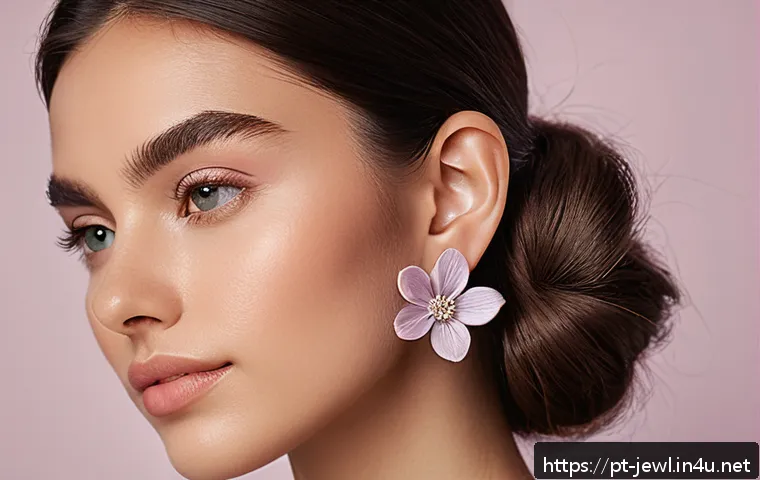플로랄 패턴 귀걸이 디자인 - A close-up portrait of a young woman wearing delicate small floral earrings made of silver with subt...